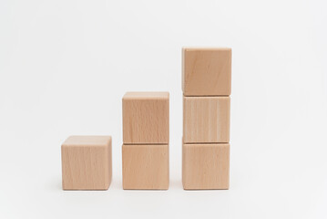 Wooden Blocks Arranged In Ascending Order On White Background