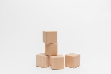 Obraz premium Wooden Blocks Arranged In Ascending Order On White Background
