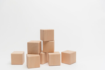 Wooden Blocks Arranged In Ascending Order On White Background