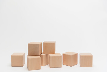 Wooden Blocks Arranged In Ascending Order On White Background