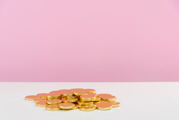 Declining Stacks of Gold Coins Representing Financial Loss
