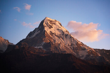 the sunrise of Annapurna South with dramatic sky at poon hill