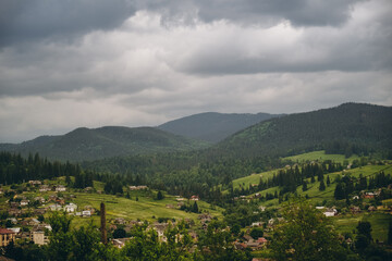 Fototapeta premium Traveling to the mountains in summer. Summer holiday in an authentic mountain village in summer.