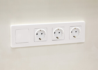Close up of an empty socket on a white wall. Electricity concept, white outlet