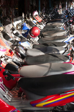 A row of parked scooters at Siem Riep Old Market (Psar Chaa), Cambodia.