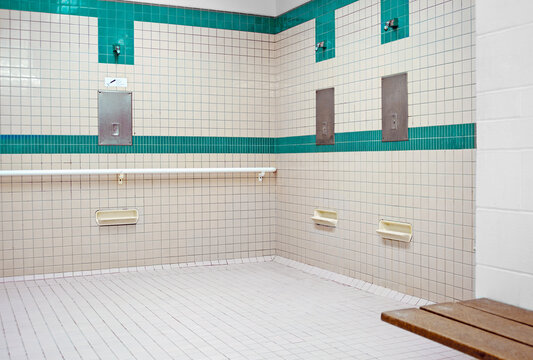 Public shower room for use before entering the swimming pool area at a recreation centre.