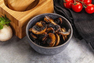 Roasted champignon mushrooms in the bowl