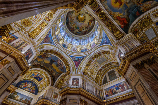 Saint Isaac's Cathedral, the 19th century cathedral interior, painted domes and wall panels and arches with plasterwork decorations.