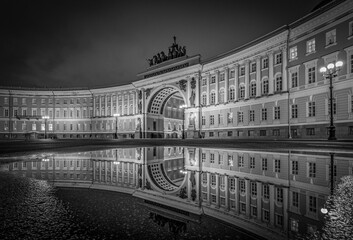 St. Petersburg. Russia. Palace Square and Arch of the General Staff Building, night, mirror reflection in water.