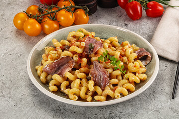 Italian pasta cellentani with anchovy