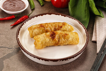 Vietnamese stuffed spring roll served sauce