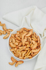 Dry pieces of apple in a bowl. Healthy food diet, vegan lifestyle, lose weight concept