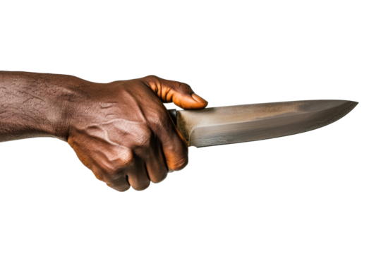 A dark-skinned hand holds a knife, the blade gleaming under soft, oblique studio lighting.