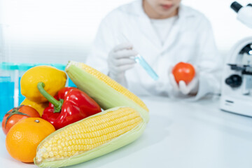 Scientist check chemical food residues in laboratory. Control experts inspect quality of fruits,...