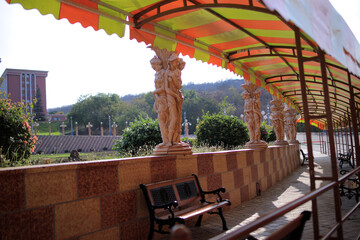 Female terracotta statue at waiting shed