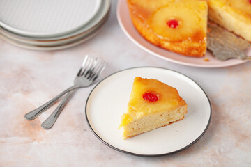 Homemade pineapple upside down pie with candied cherries . Tropical dessert on white background.