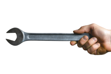 A hand, weathered and strong, grasps a gleaming wrench, held out against a stark white background. The focus is on the wrench, its metallic sheen reflecting the studio lighting.