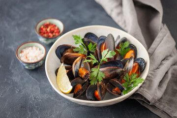 Mussels with lemon in bowl  . Seafood . Mediterranean cuisine