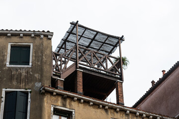 Small wooden pavilion on house roof in Venice