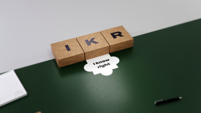  IKR abbreviation of I know right, 3D acronym wood text block concept on green and white background