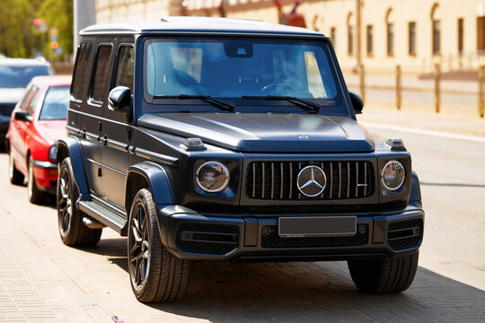 Minsk, Belarus. Apr 27, 2024. Mercedes-Benz G-Class AMG W463 G63 front view on grille and headlights. Mercedes-Benz G-Class Gel&auml;ndewagen parked on parking lot at roadside