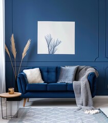 A blue velvet sofa sits in a modern living room, with a wooden shelf above it and a grey throw blanket draped over the back.