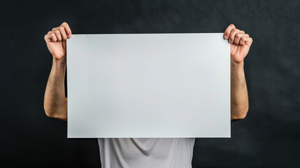 holding up a blank sign with both hands