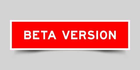 Square sticker label with word beta version in red color on gray background