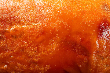 sking of a roasted pig as background and texture