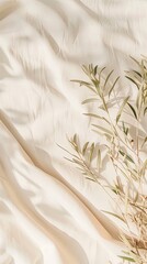 Brown and tan autumn leaves scattered on a white fabric background