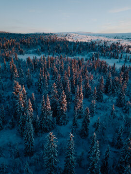 Sunrise Over Snowy Ringebu Mountains - Aerial View