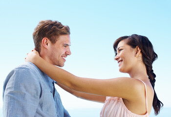 Outdoor, couple and smile with hug for bonding with love, trust and support in Spain. People,...