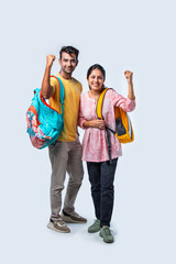 Obraz premium Two Happy Indian College Students with Bags and Laptop, Isolated on White Background