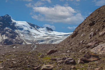 Panorama of the Barba d'Orso glacier surface with melting stream at its forehead, Vallelunga, Alto Adige - Sudtirol, Italy. Popular mountain for climbers