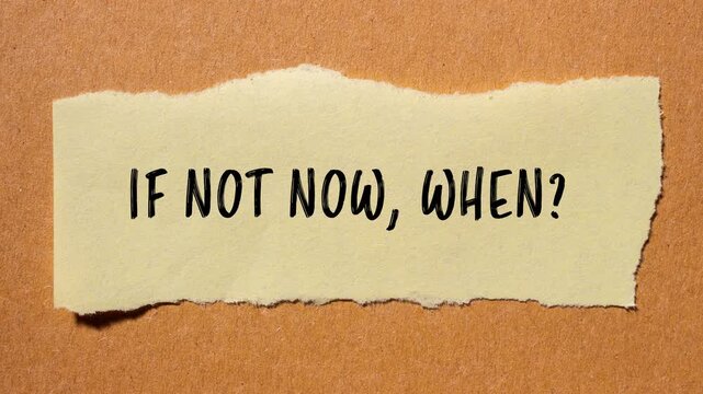 If not now when question message writing on ripped torn paper piece with brown background