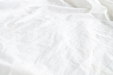 Abstract White Bedding Sheets or White wrinkled fabric background texture and Texture with copy-space :Creased or wrinkled white fabric,Soft focus