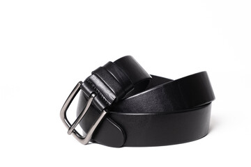 Twisted black leather belt with matted metal buckle isolated on white background. Fastened fashionable unisex, man or woman accessory for trousers, jeans, dress. Male luxury strap. Haberdashery goods