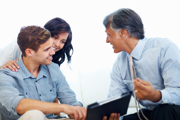 Couple, financial advisor and document in home for discussion, planning and budget management for...