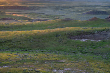Sun setting over hilltops in the Valley of 1000 Devils in Grasslands National Park, Saskatchewan