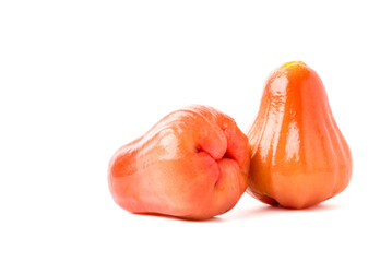 Two shiny, bright  rose apples arranged side by side. isolated on white background.