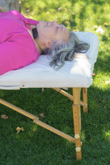 woman lying on a stretcher during magnet therapy treatment
