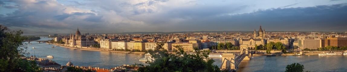 Panoramic view of the Dabube river and the Pest side of Budapest, with the Chain Bridge, St. Stephen's Basica and the Hungarian Parliament prominent in the skyline. Budapest Hungary