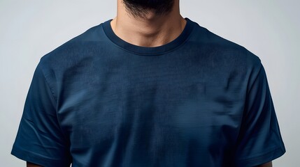 Plain navy blue t-shirt on invisible mannequin, pure white background, studio product photography, crisp detail of fabric texture, subtle shadowing, professional fashion catalog style.