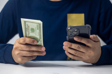 Money acquisition through phone calls is the strategy employed by the businessperson.