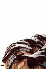 Decadent chocolate-drizzled croissants garnished with chocolate shavings, presented on a white background for a luxurious treat.