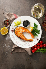 Top view of grilled salmon red fish steak on a plate