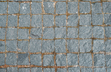 Cracked concrete wall covered with gray cement surface. Grey old wall with shabby damaged plaster or cement and brick background of an vintage dirty exfoliating plaster. Mock up.