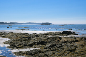 clear blue ocean tide shore and sky, mist over rocks, natural phenomenon