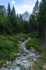 Melting river from Sorapis lake, Dolomite Mountains, Italian Alps, Italy