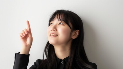 Portrait of smiling business woman pointing finger
